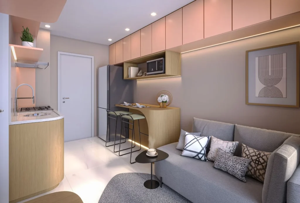 Sala de estar integrada à cozinha compacta com bancada e banquetas, em tons neutros